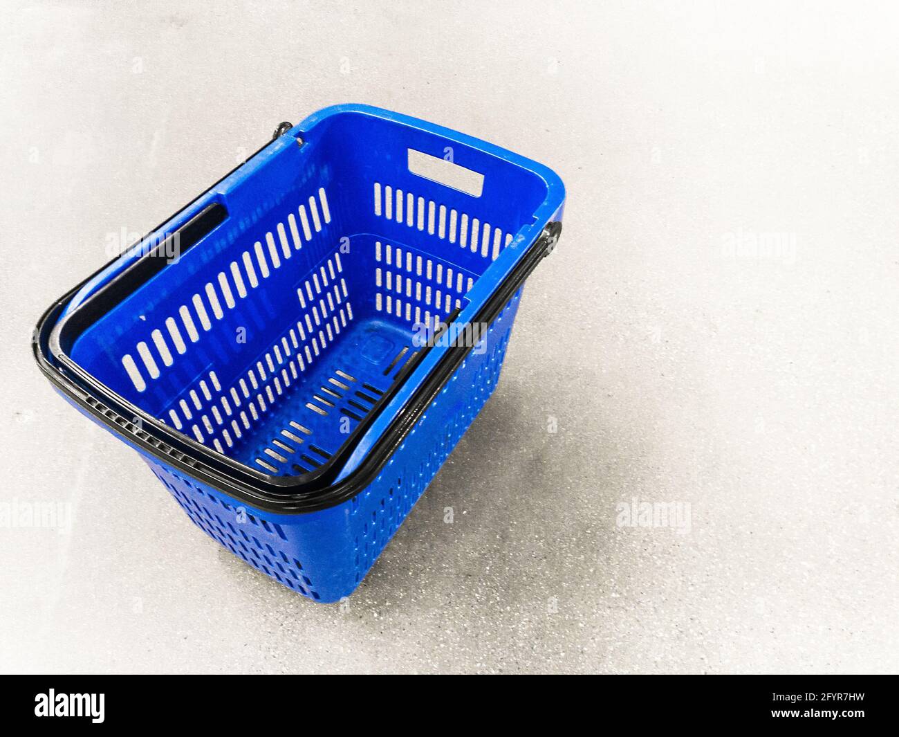 empty shopping basket on floor Stock Photo