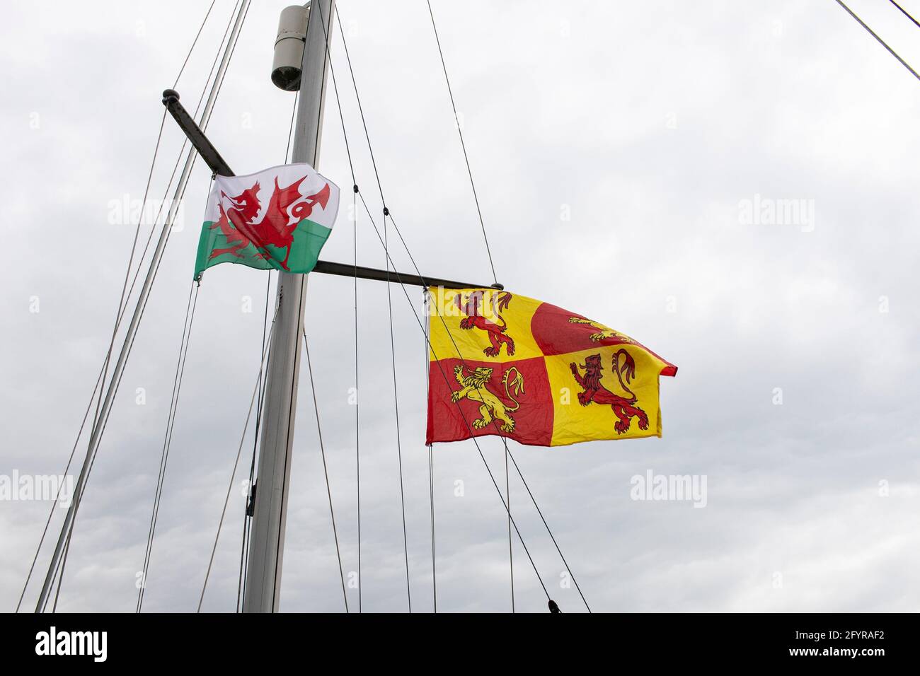 Welsh flags fly at Caernarfon Harbour on the 29th May 2021 Credit: Lewis Mitchell Stock Photo