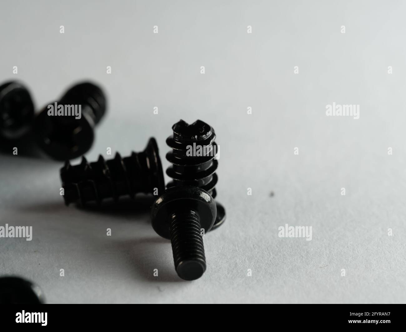 Screw Empty Dramatic grayscale shot of black screws on an empty surface Stock Photo ...