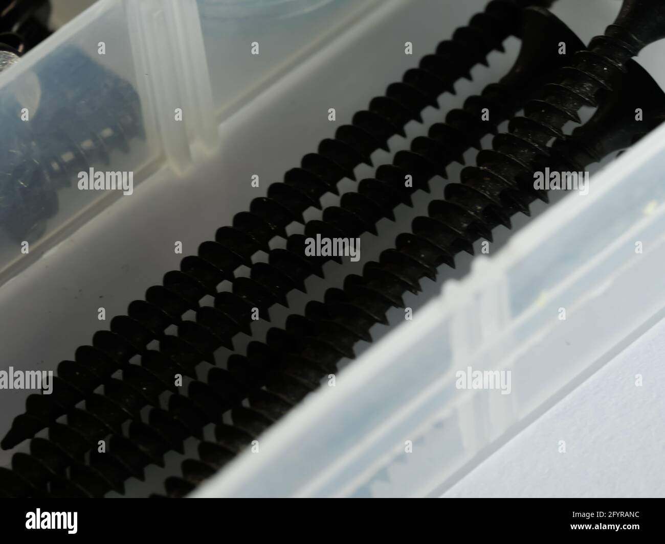Screw Empty Dramatic grayscale shot of black long screws on an empty surface Stock ...