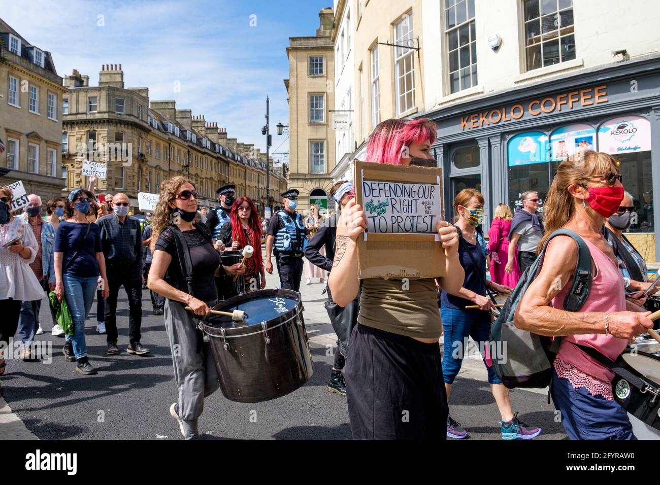 Bath, Somerset, UK. 29th May, 2021. Kill the bill protesters carrying anti government placards and signs are pictured as they take part in a kill the bill protest march through the centre of Bath. The protesters took to the streets to demonstrate about the police, crime, sentencing and courts bill which the UK government wants to bring into force.The bill includes major government proposals on crime and justice in England and Wales. Credit: Lynchpics/Alamy Live News Stock Photo