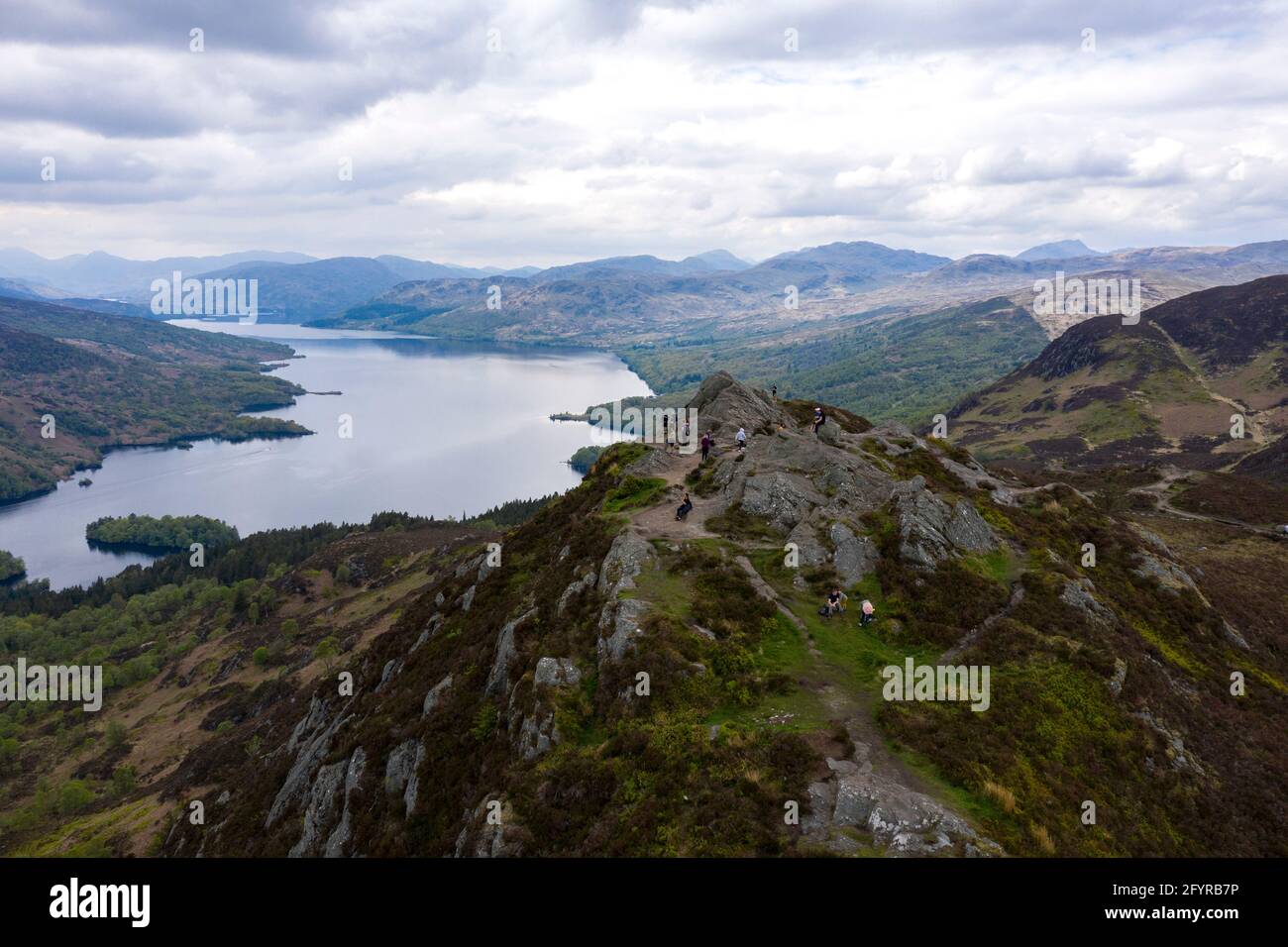 Ben A'an Summit, Loch Lomond and Trossachs National Park, Scotland, UK. 29th May, 2021. PICTURED: People flock to the outdoors and hill climbers and casual day trippers are seen on the mountain top of Ben A'an Pic Credit: Colin Fisher/Alamy Live News Stock Photo