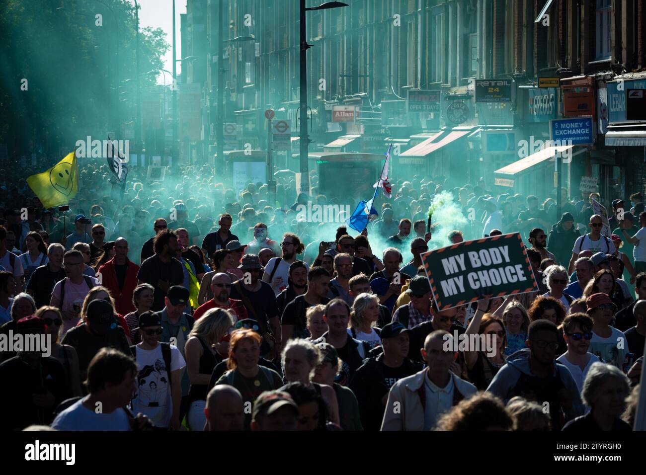 Manchester, UK. 29th May, 2021. People prepare to march ahead of a anti-lockdown protest. The number of people attending the protests has increased month on month since the introduction of the COVID-19 restrictions. Credit: Andy Barton/Alamy Live News Stock Photo
