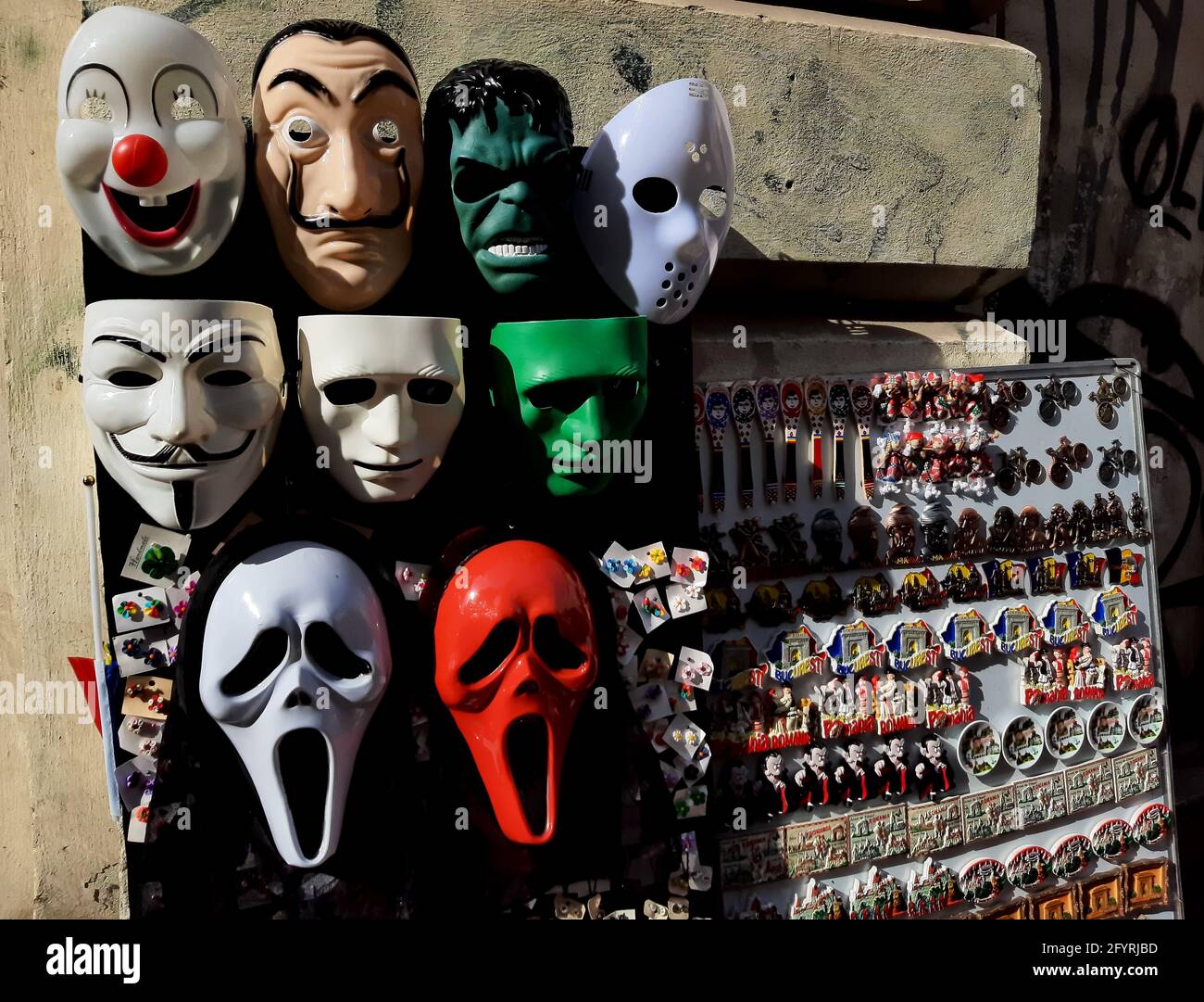 Bucharest, Romania - October 21, 2020: Movie character masks are sold at a stall of a souvenir magnets street vendor in Bucharest. Stock Photo