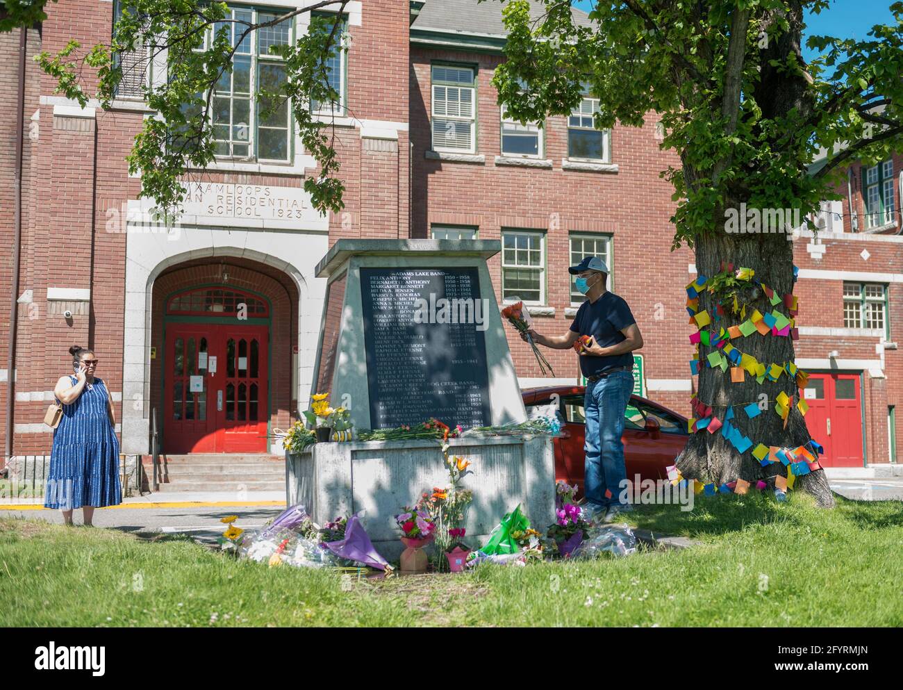 People Lay Flowers In Front Of The Administration Building At The Former Kamloops Indian Residential School After The Remains Of 215 Children Some As Young As Three Years Old Were Found At