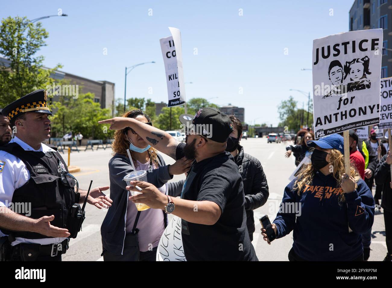 USA. 29th May, 2021. A supporter of Anthony Alvarez argues with Chicago police officers during a protest outside of the 16th District precinct of the Chicago Police Department in the Jefferson Park neighborhood in Chicago, Illinois on May 29, 2021. Anthony Alvarez was shot and killed by Chicago Police officer Evan Solano during a foot pursuit on March 31, 2021. (Photo by Max Herman/Sipa USA) Credit: Sipa USA/Alamy Live News Stock Photo