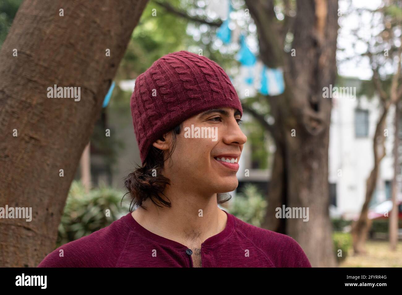 Young hispanic man wearing a beanie Stock Photo