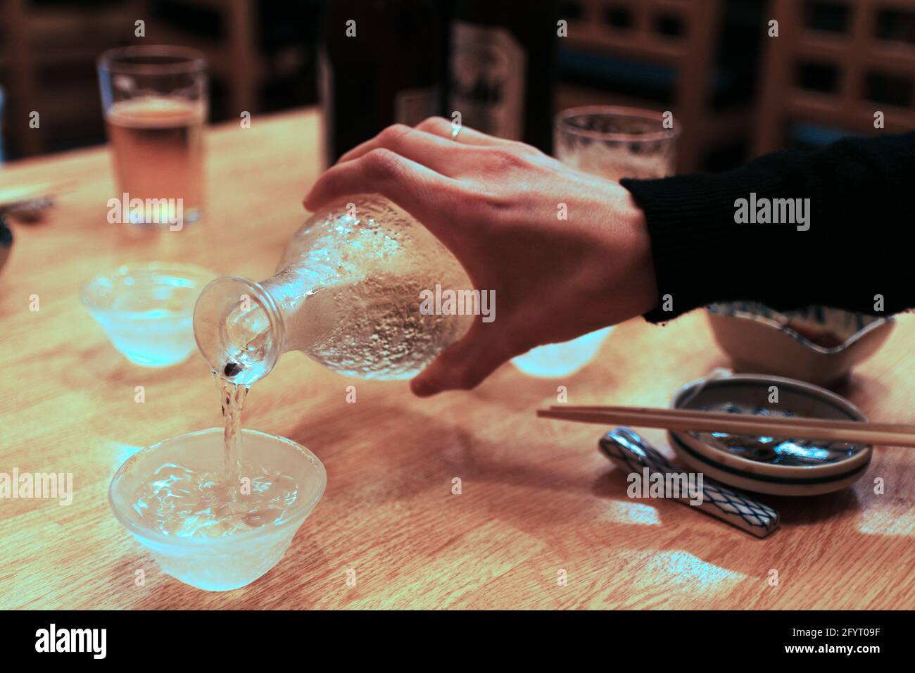 Sake tasting in a Japanese pub Stock Photo