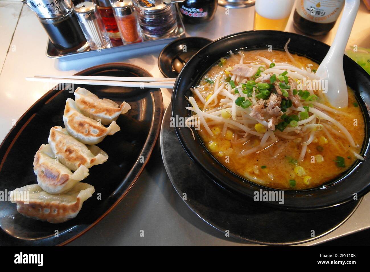 Ramen (noodles in a thick pork broth) with gyoza (fried dumplings Stock Photo Alamy
