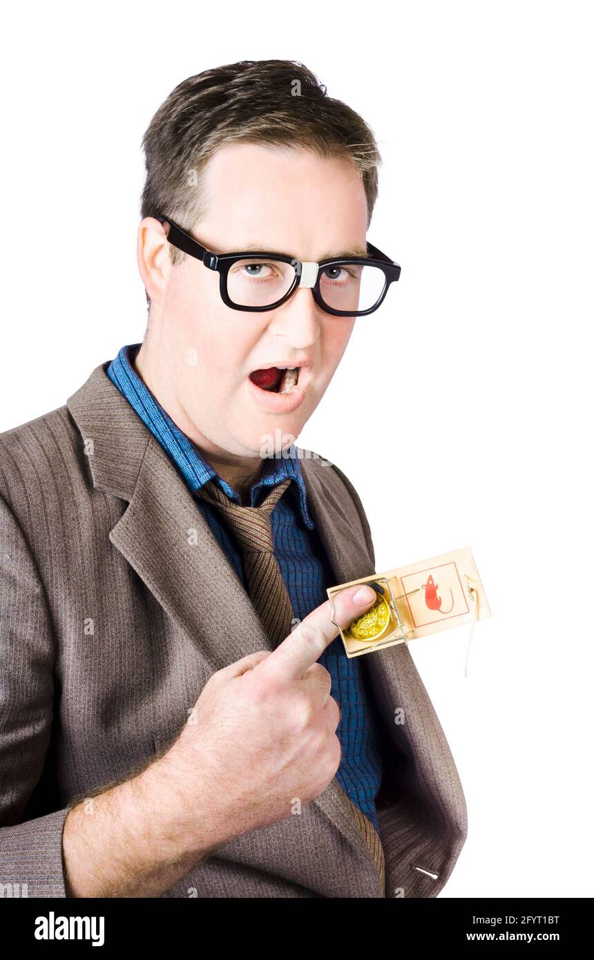 Businessman's Finger With Coin Caught In Mousetrap Stock Photo