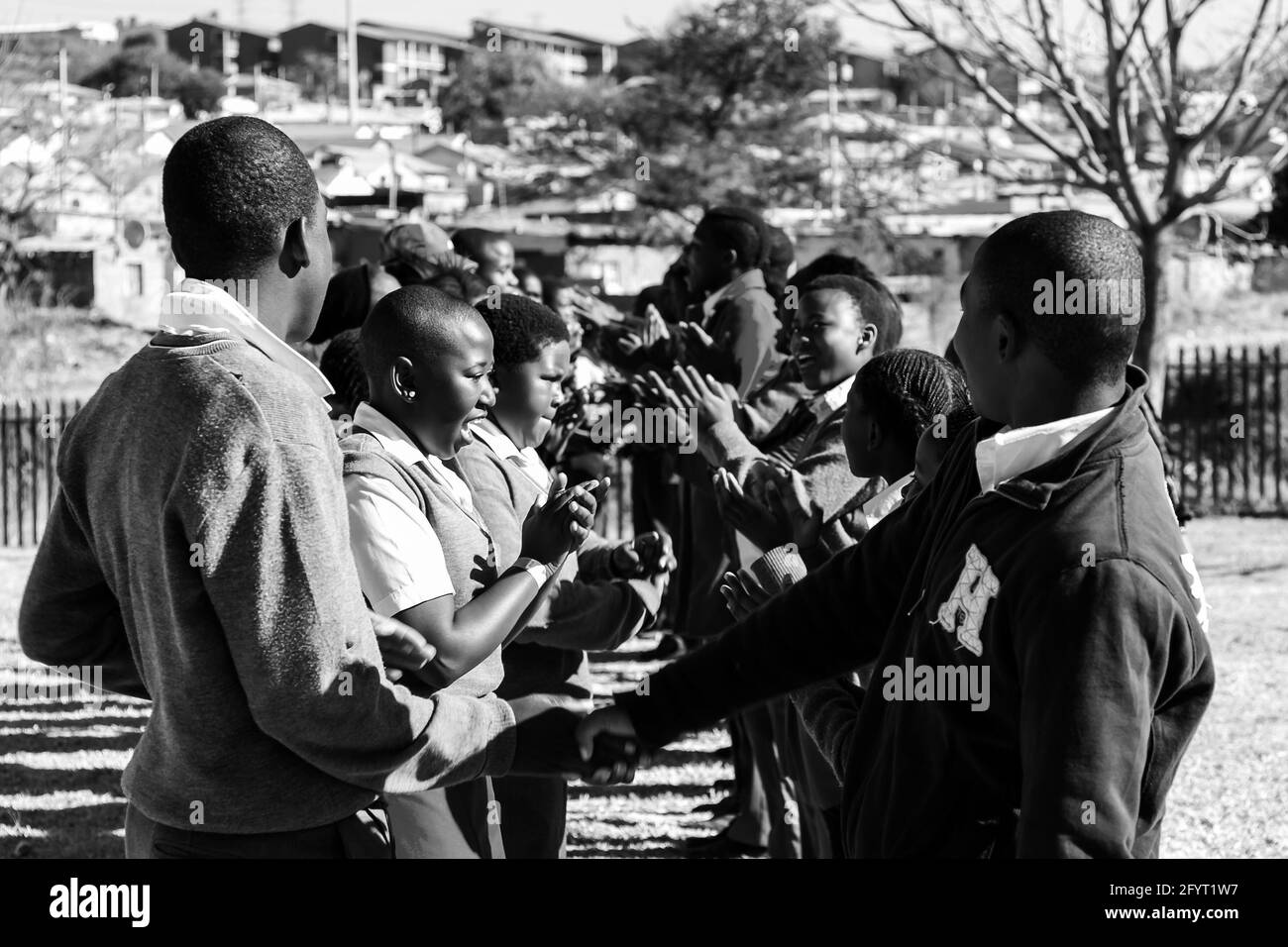 JOHANNESBURG, SOUTH AFRICA - Jan 05, 2021: Johannesburg, South Africa - June 19, 2014: Diverse African high school pupils playing physical games on th Stock Photo