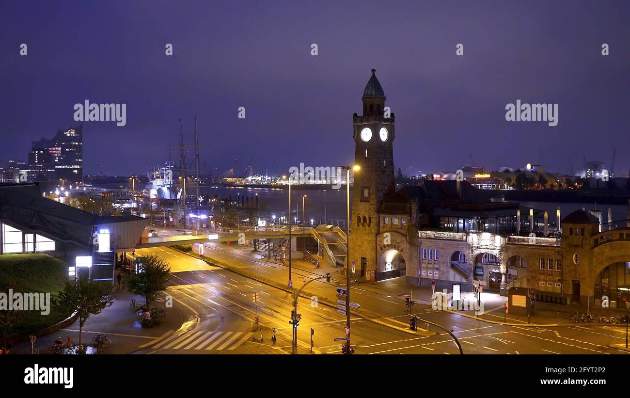 Famous St Pauli Landungsbruecken at the port of Hamburg - amazing evening view - HAMBURG CITY, GERMANY - MAY 10, 2021 Stock Photo