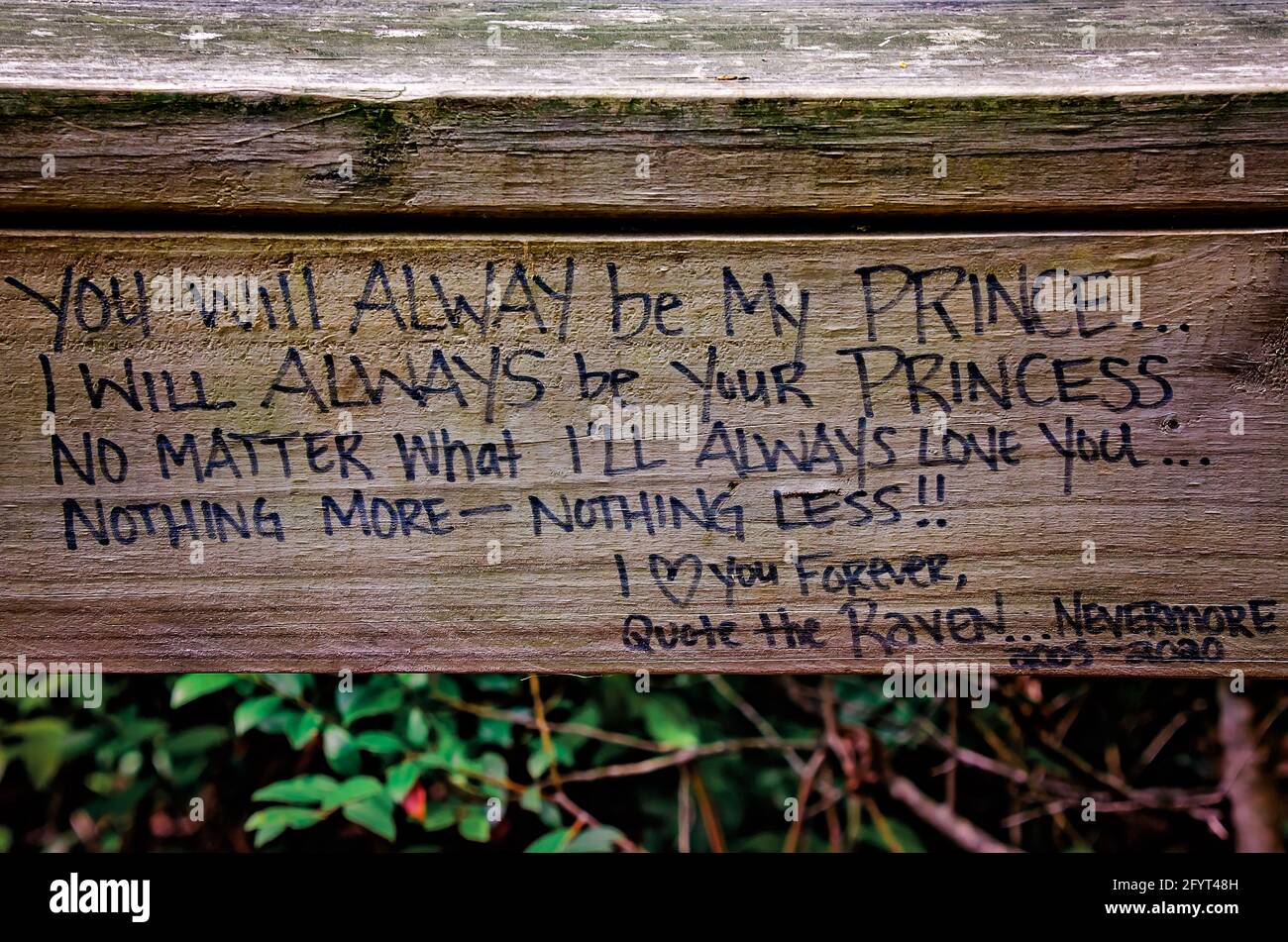 A love letter is scrawled on the wooden railing at Magnolia Landing, May 27, 2021, in Magnolia Springs, Alabama. Stock Photo
