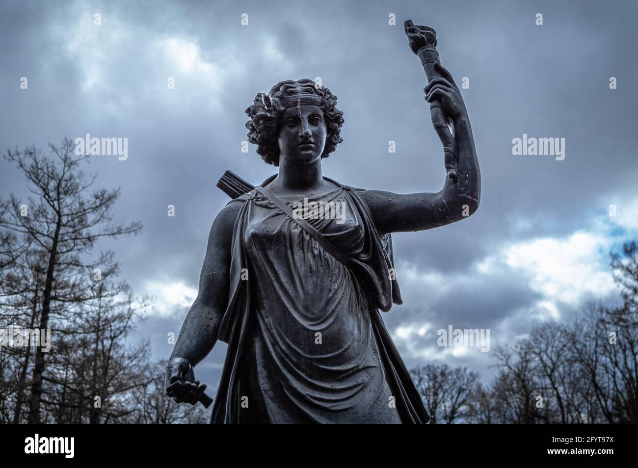 Copper monument to Artemis in the city of Pushkin (Tsarskoye Selo), Russia. Greek goddess of the hunt, the wilderness, wild animals, and the Moon. Stock Photo