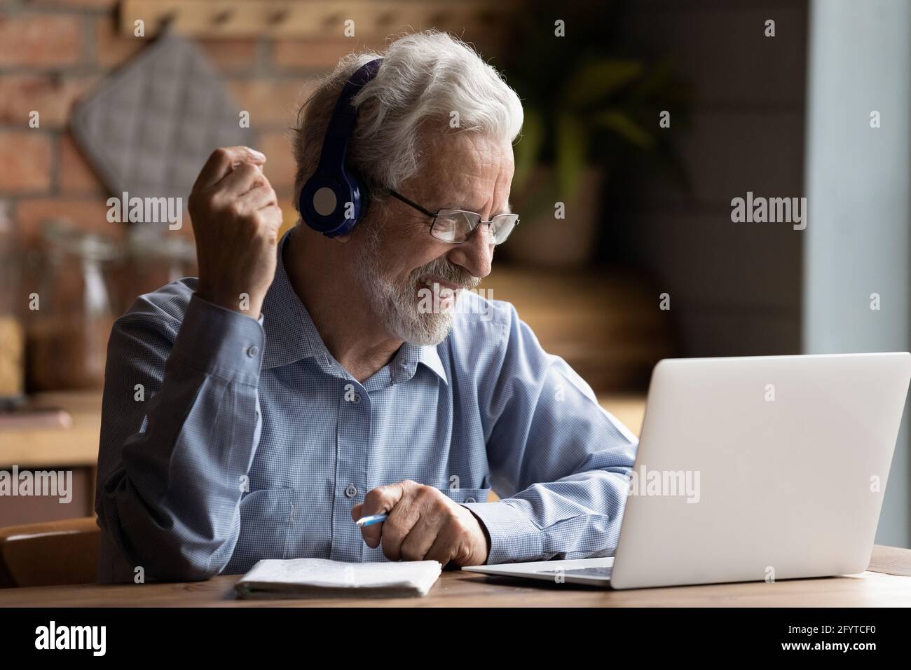 Mature man use laptop gain new knowledge use internet resources Stock Photo