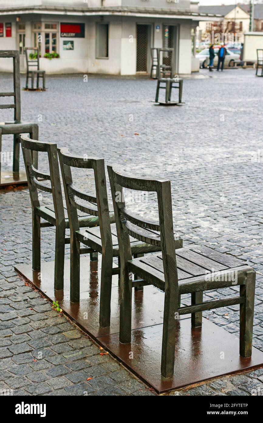 Chairs monument at the cobbled square in Krakow, Poland Stock Photo Alamy
