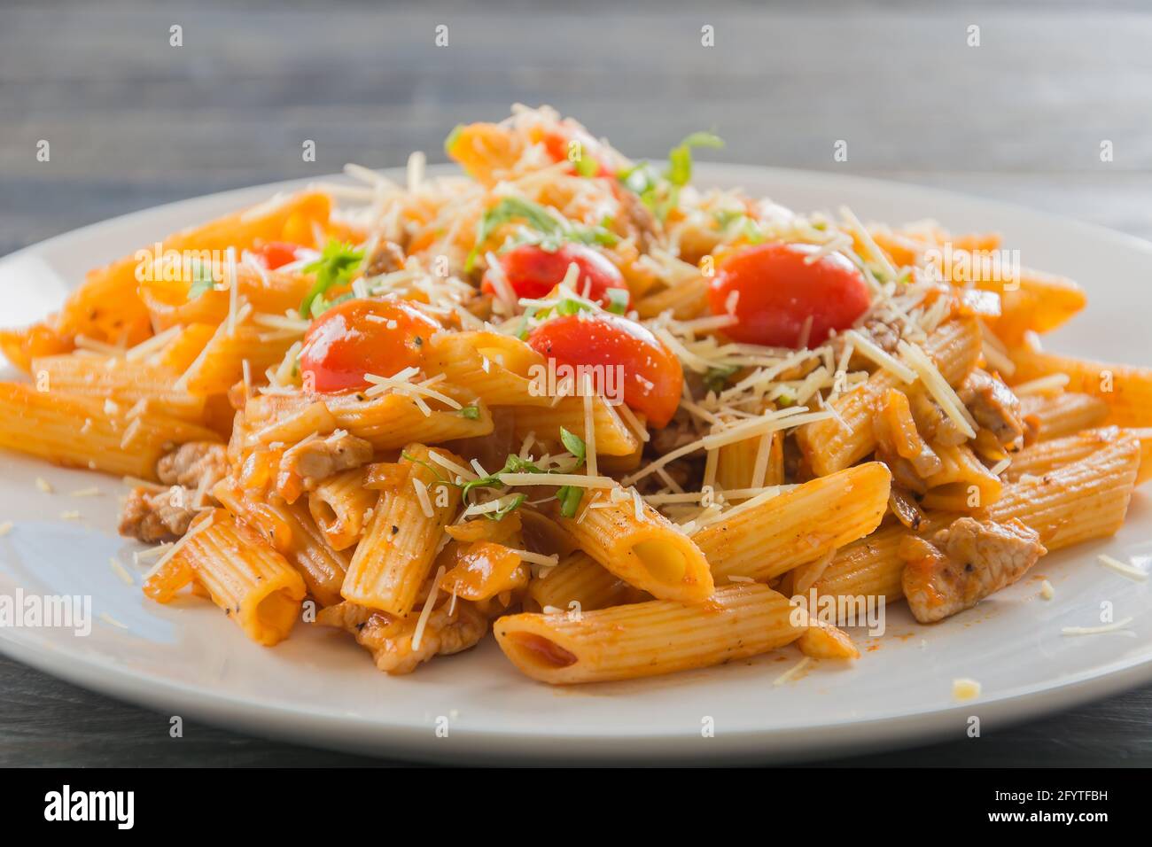 Penne pasta in tomato sauce Stock Photo - Alamy