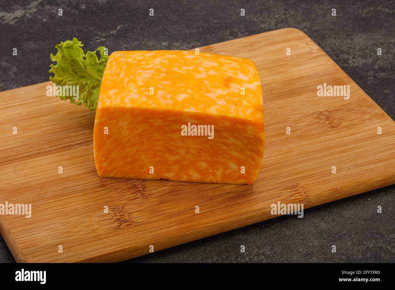 Dairy Marble cheese brick over board Stock Photo Alamy