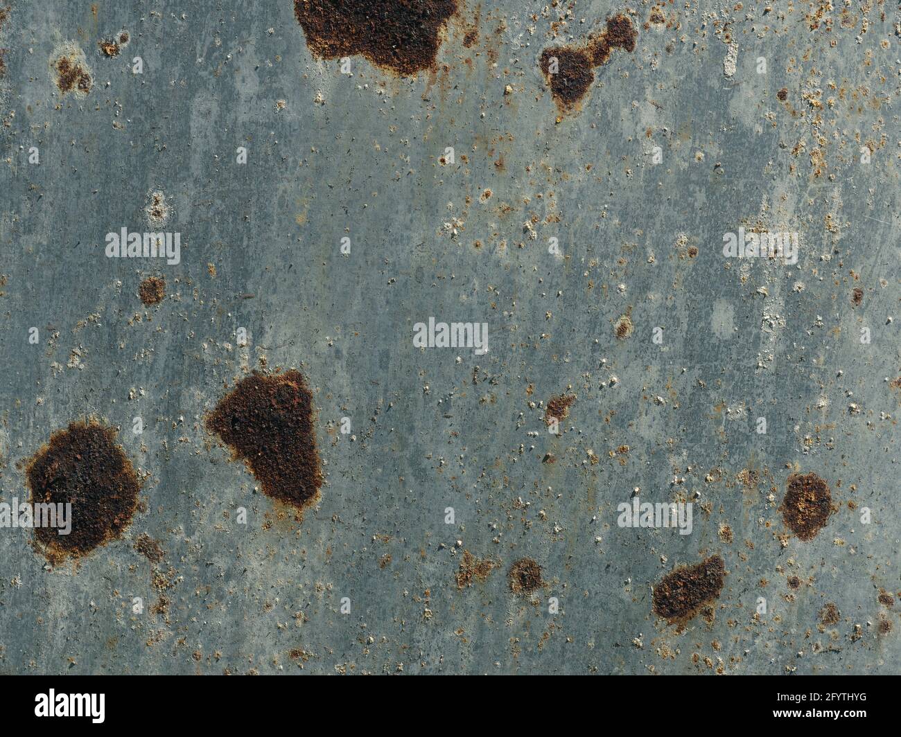 Galvanized steel surface with rust spots using as background Stock