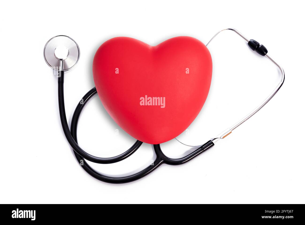 Health Care treatment concept - red heart shape with medical stethoscope on a white background Stock Photo