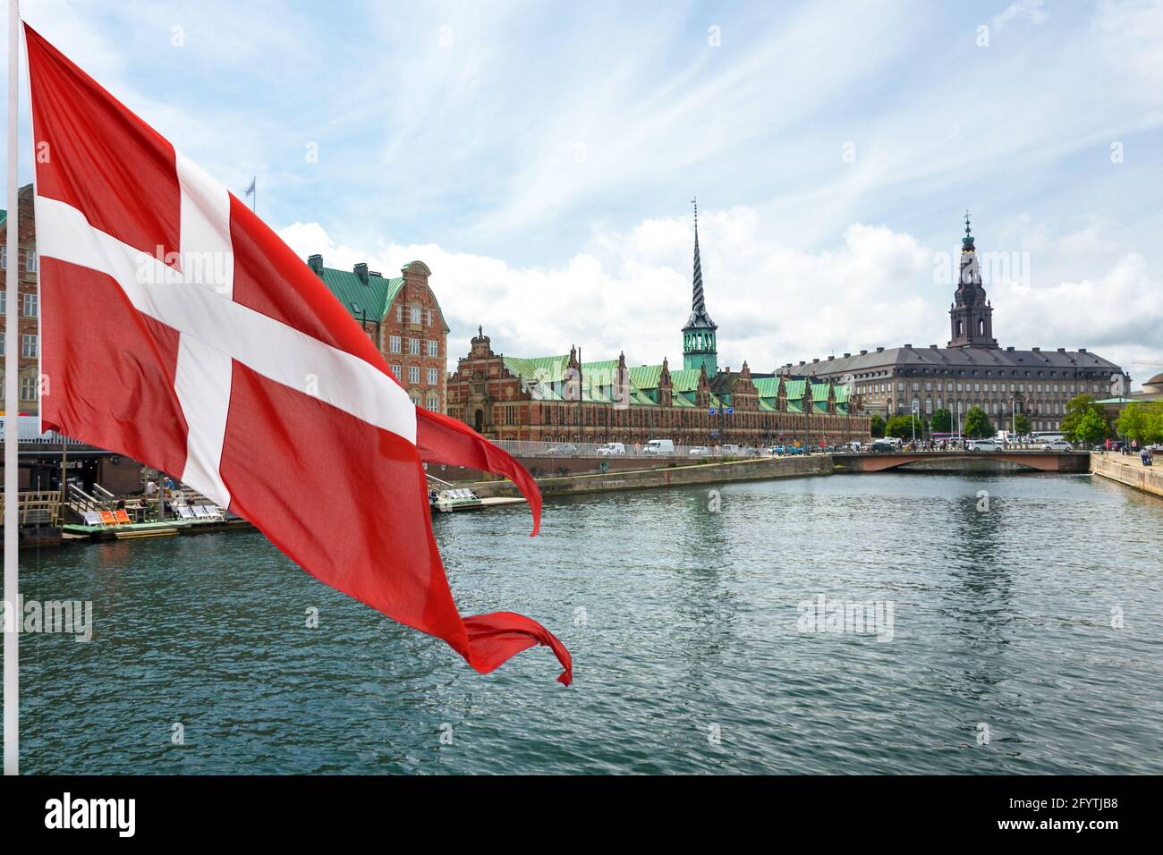 Flag of Denmark on the background of The Historic Old Town of Copenhagen. Stock Photo
