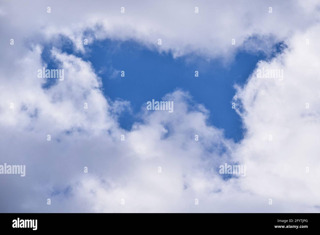 A low angle shot of the beautiful and fluffy clouds in the blue sky ...