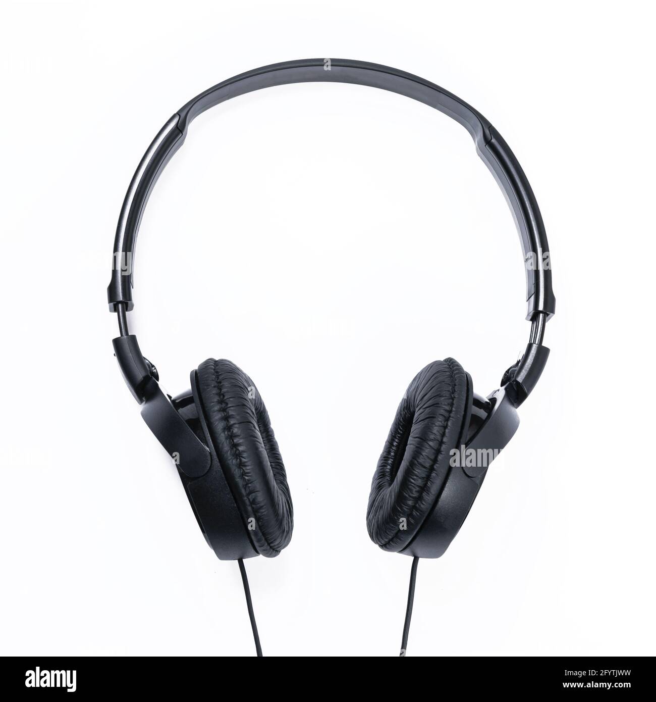 Modern black wired headphones isolated on a white background in close-up Stock Photo