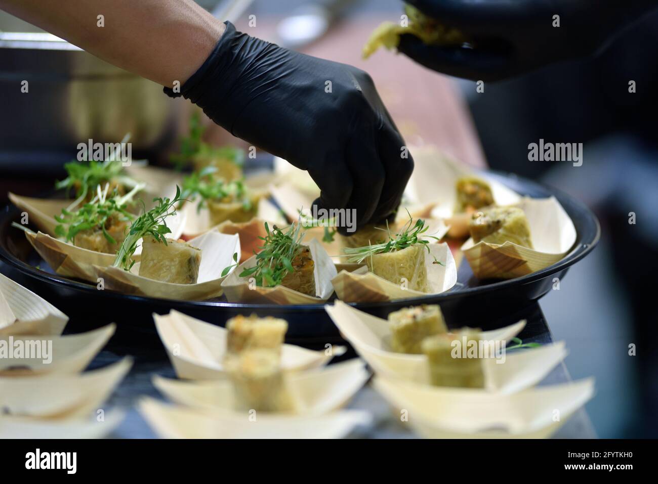 Chef preparing meal in the hotel restaurant in close-up Stock Photo