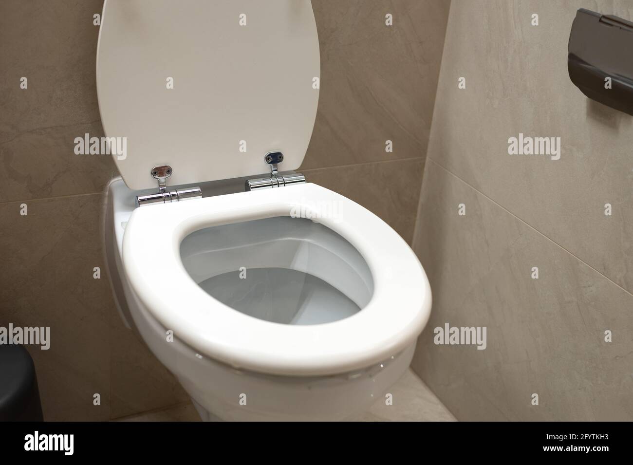 White new ceramic toilet bowl in the bathroom in close-up Stock Photo