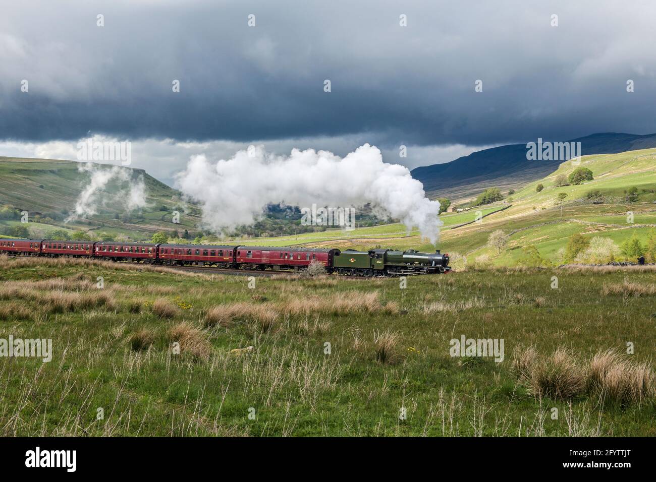 The Salesman steaming past Aisgill in the Yorkshire Dales National Park on a sunny May afternoon. Stock Photo