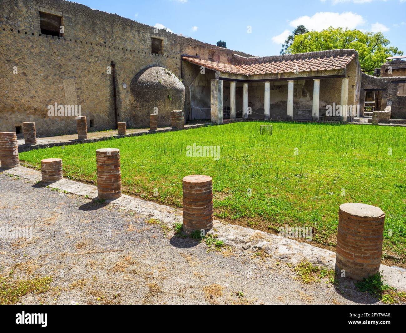 The men's baths palaestra which served not only as a recreational area, but also as a meeting place and an open-air lounge. - Central Thermae (Terme Centrali) - Herculaneum ruins, Italy Stock Photo