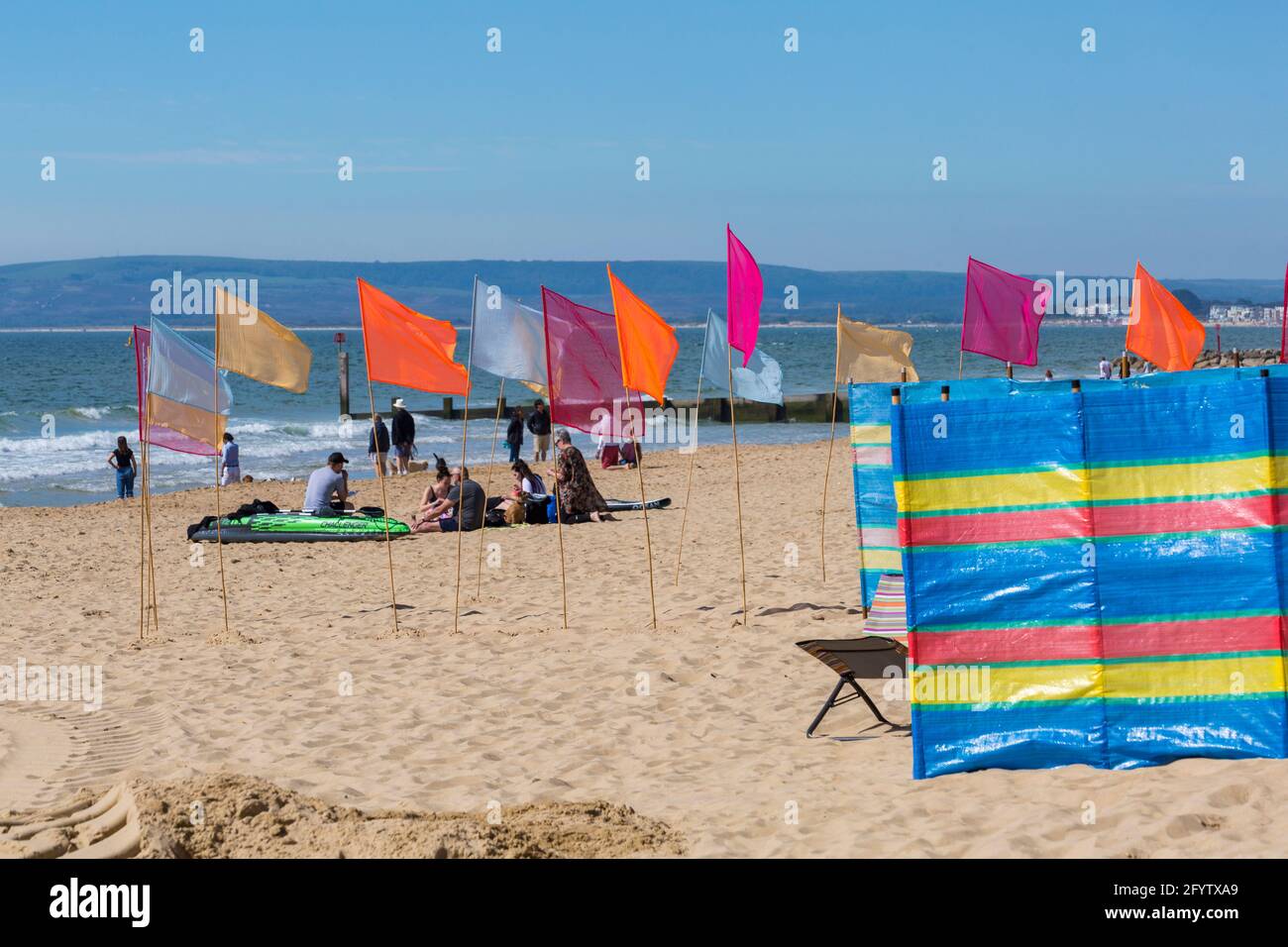 Bournemouth, Dorset UK. 30th May 2021. UK weather: hot and sunny at Bournemouth beaches, as people flock to the seaside to enjoy the sunshine for Bank Holiday Sunday, as more people take staycations because of restrictions on foreign travel due to Covid. Credit: Carolyn Jenkins/Alamy Live News Stock Photo