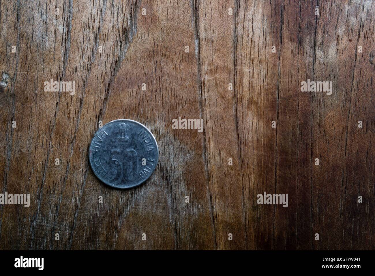 A table top shot of a coin of 50 paisa of Indian denomination. Indian coins. Stock Photo