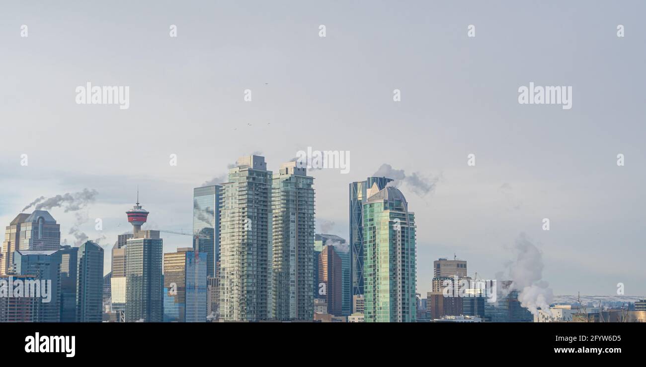 Calgary Alberta Downtown skyline in winter - Steam from buildings Stock Photo