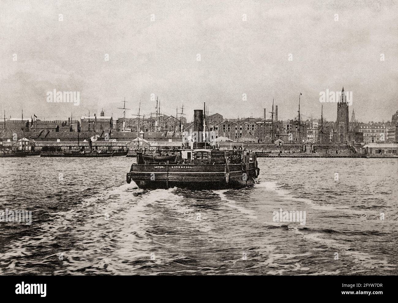A late 19th century view of a steam ferry crossing the River Mersey from Birkenhead to Liverpool.  Ferries have been used on this route since at least the 12th century, and by the 1840s, Birkenhead was developing into a busy new town. The railway to Chester had opened, the town was growing quickly, and docks were under construction. In 1847, the first floating landing stage, which rose and fell with the tide so that boats could dock at any time, was opened at Liverpool. Stock Photo
