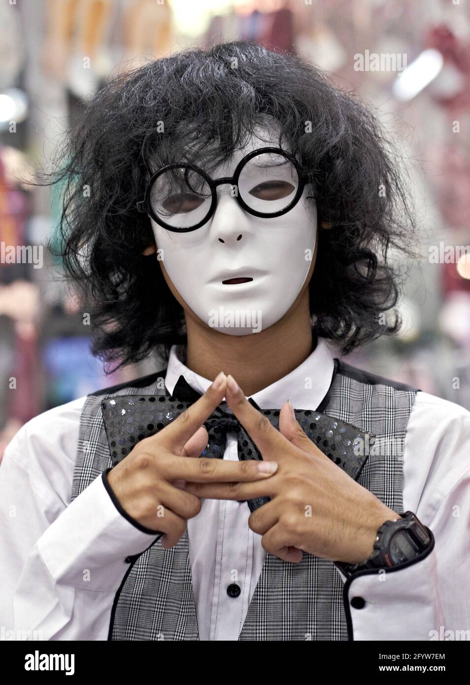 Mime artist wearing white face mask Stock Photo Alamy