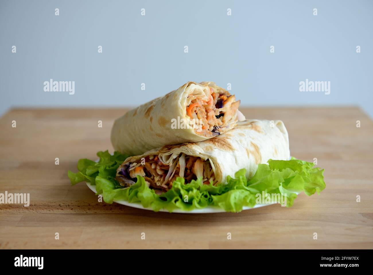 A cut kebab, shawarma, with grilled meal and vegetables Stock Photo