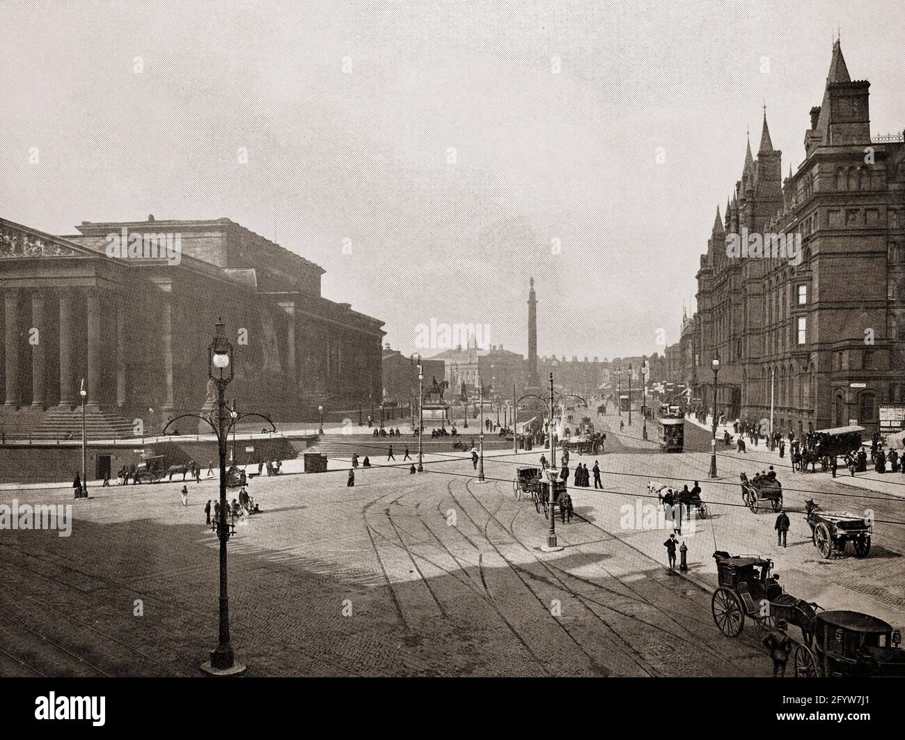 A late 19th century view of Lime Street in Liverpool, England, named after the lime kilns owned by a local businessman. With the arrival of the railway line in 1836, the street moved from a marginal to a central location in the city, a position that confirmed by the creation of St George's Hall, on the side of the street opposite the railway station, in 1854.  Wellington's Column, a monument to the Duke of Wellington was built to mark one end of the street, at the corner with William Brown Street. Stock Photo