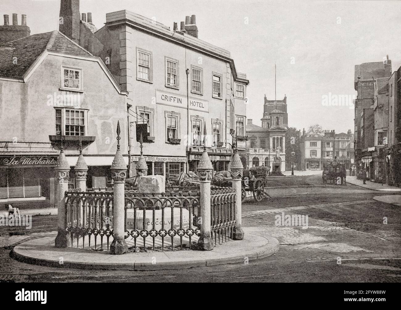 A late 19th century view of the Market Place in Kingston upon Thames aka Kingston, a town and borough in Greater London and within the historic county of Surrey, England. The first surviving record of Kingston is from AD 838 as the site of a meeting between King Egbert of Wessex and Ceolnoth, Archbishop of Canterbury. Many kings who are said to have been crowned in the chapel of St Mary, which collapsed in 1730. Tradition suggests that a large stone recovered from the ruins played a part in the coronations. Initially used as a mounting block, it was moved to the market in 1850 as seen in the p Stock Photo
