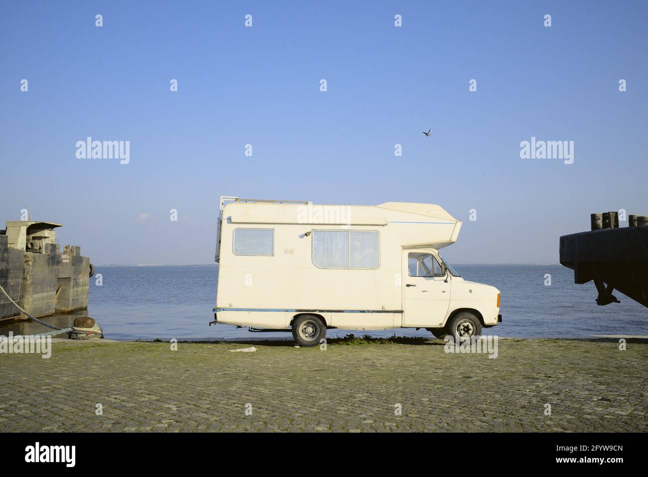Vintage camper van parked by the riverfront Stock Photo - Alamy