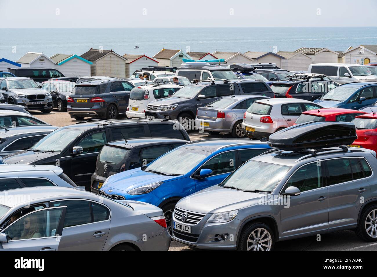 Lyme Regis, Dorset, UK. 30th May, 2021. UK Weather. The car parks at Lyme Regis were packed to capacity as peopled flocked to the beach to enjoy scorching hot sunsine as the heatwave continues. Credit: Celia McMahon/Alamy Live News Stock Photo