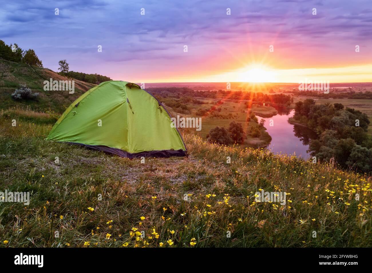 tourist tent on the hill near the river Stock Photo - Alamy