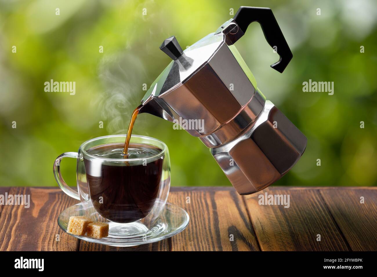 espresso pouring from flying geyser coffee maker into cup Stock Photo Alamy