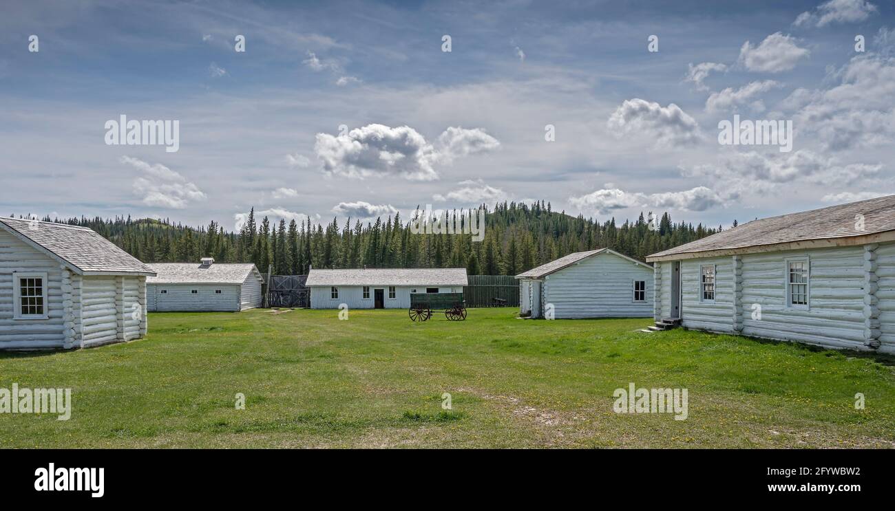 Maple Creek, Saskatchewan, Canada May 27, 2021 Log buildings and wagon at Fort Walsh National