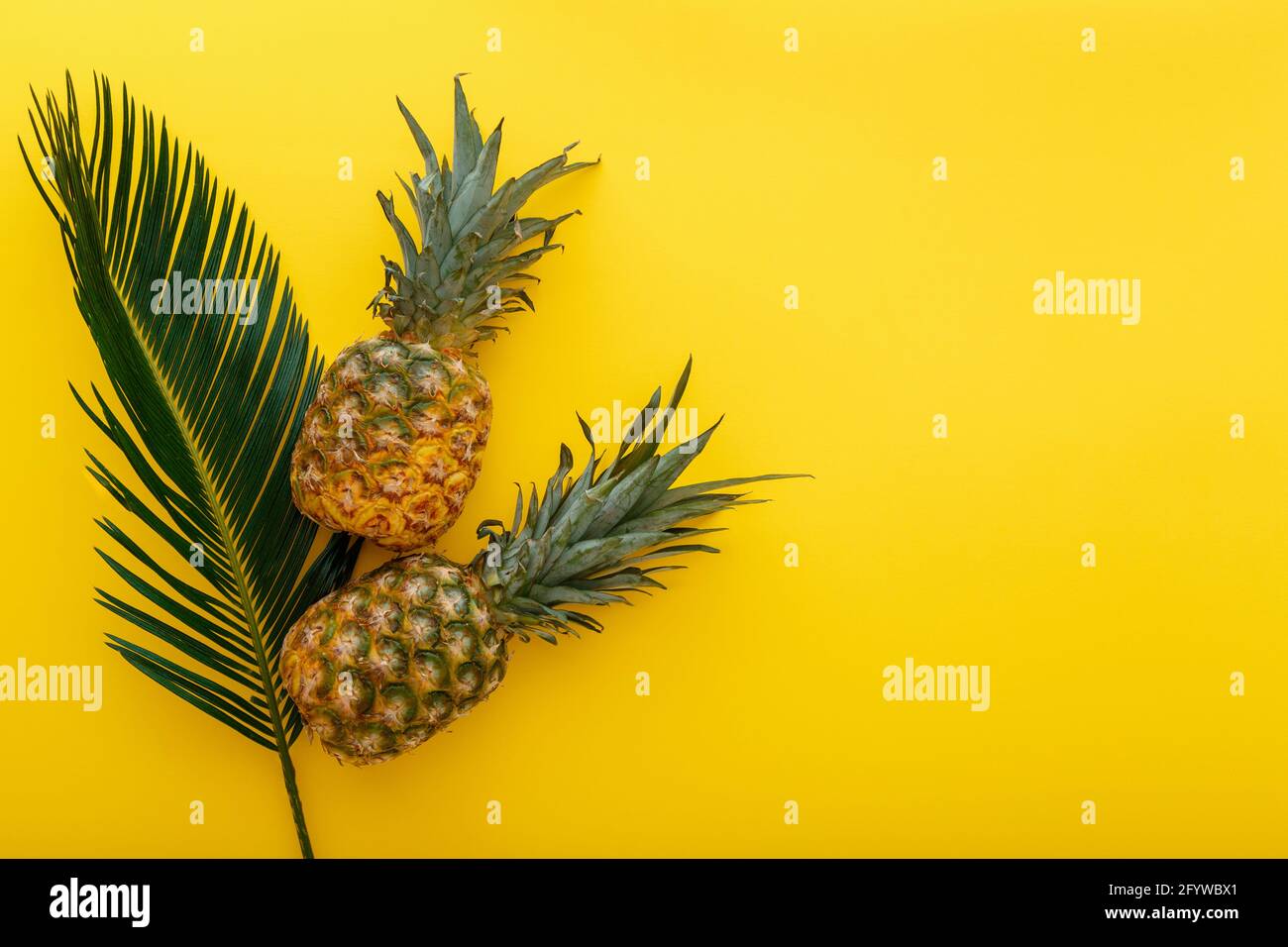 Pineapples And Palm Leaves On Yellow Color Summer Background Tropical Summer Pineapples Fruits