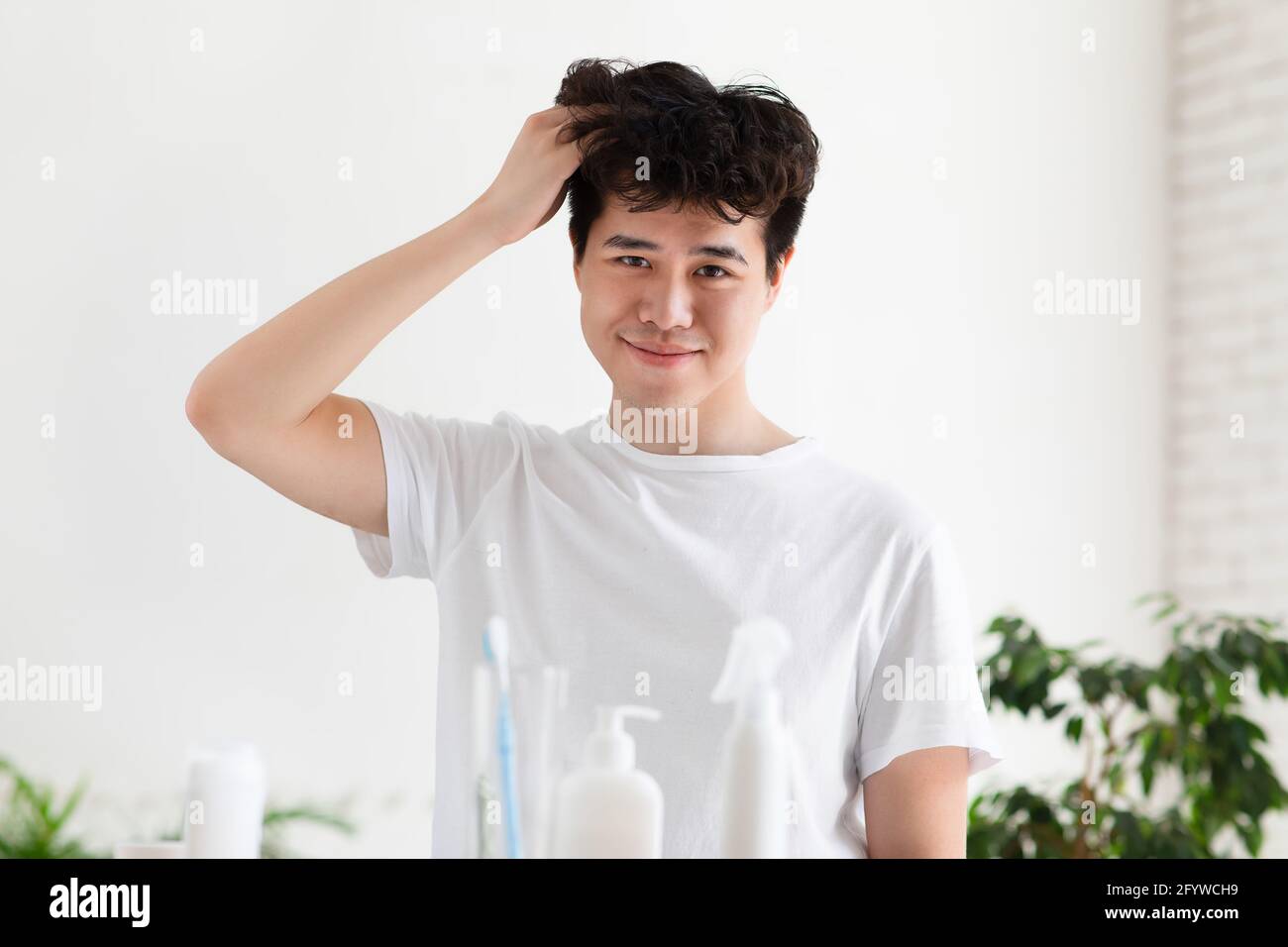 Hair care at home, daily procedure and morning hygiene at covid-19 self-isolation Stock Photo