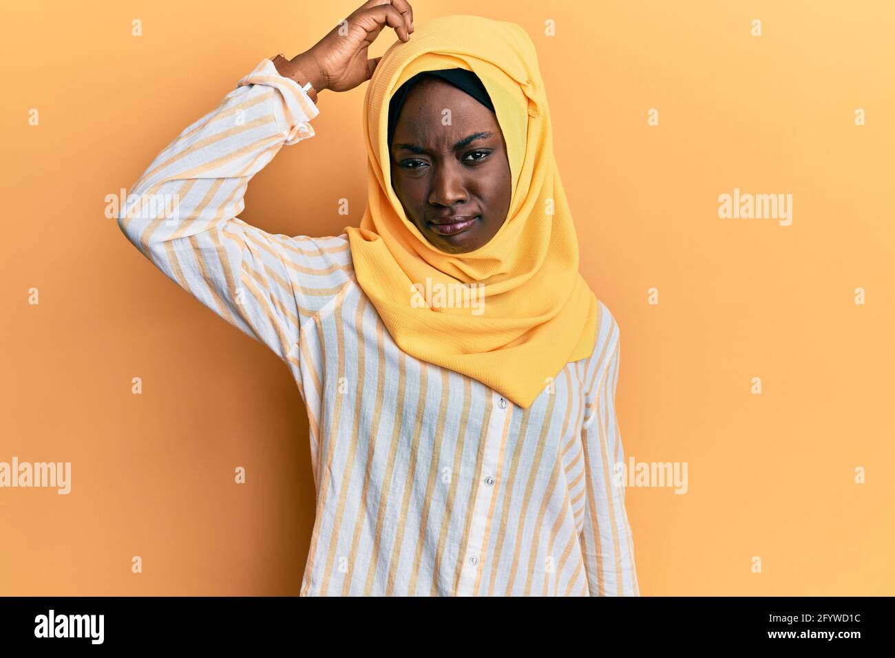Muslim Young Woman Weared in Traditional Dress and Scarf Touches Her Face  and Relax. Relaxation and Meditation with Yoga Stock Image - Image of  beauty, arabic: 222184603