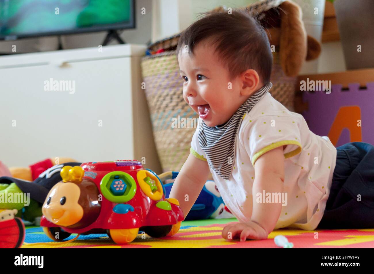 A cute little boy playing with a toy car at home Stock Photo - Alamy