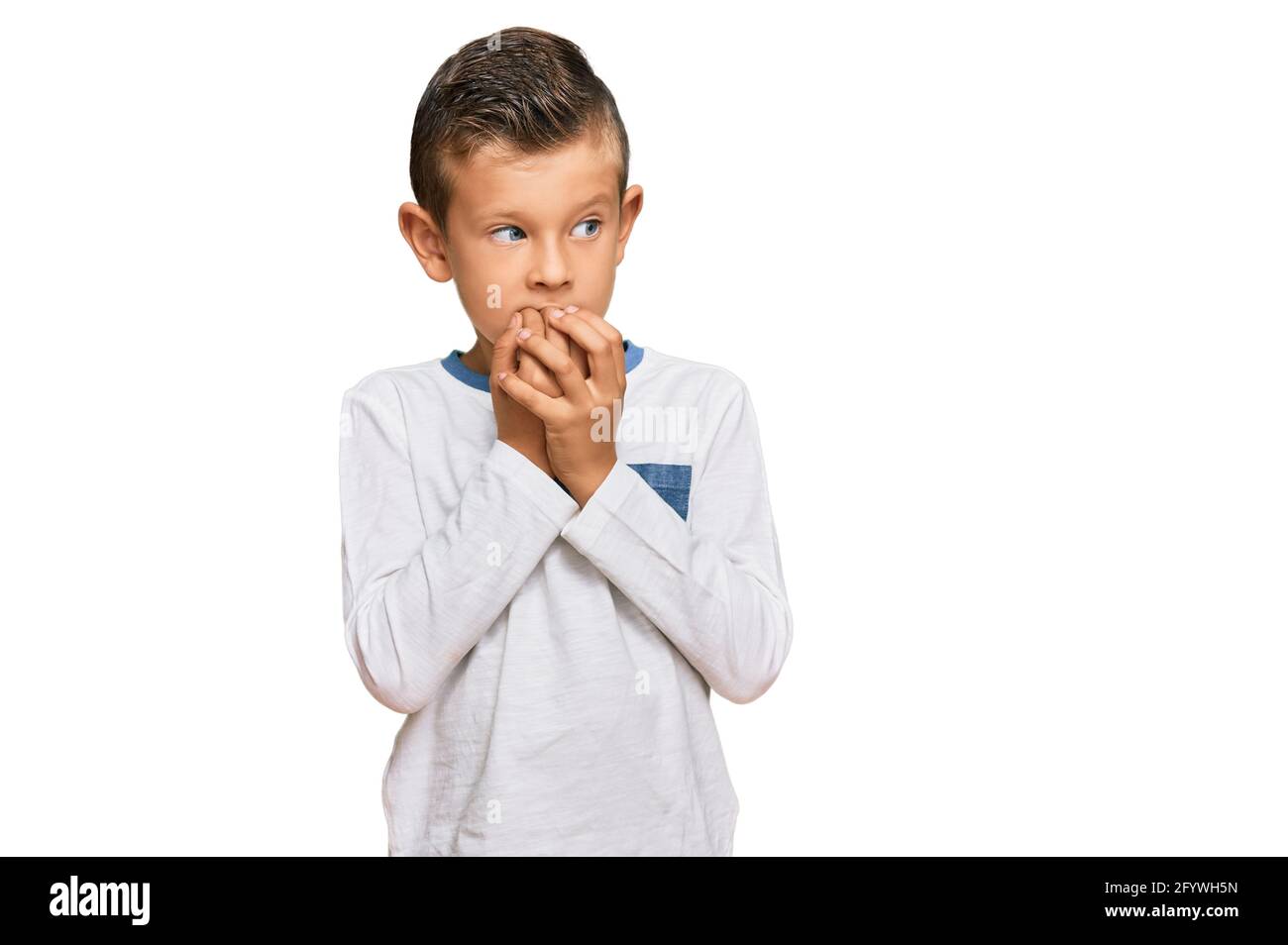 Adorable caucasian kid wearing casual clothes looking stressed and
