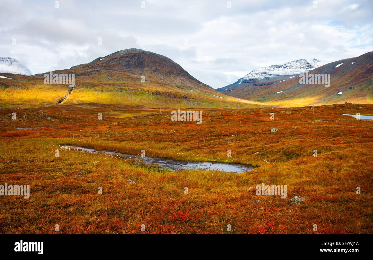 Hiking Kungsleden (king's) trail, between Sälka and Singi, amazing colors at sunrise, Lapland, Sweden, September 2020. Stock Photo